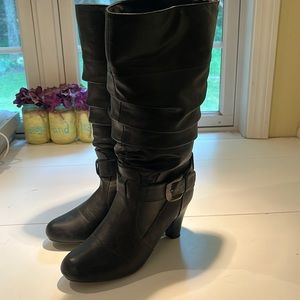 Woman’s heeled mid calf boots